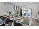 Modern kitchen featuring granite countertops, updated appliances, and a convenient breakfast bar at 12829 Kings Lake Dr, Gibsonton, FL 33534