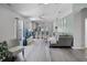 Open-concept living room featuring hardwood floors and seamlessly connects to the kitchen area at 12829 Kings Lake Dr, Gibsonton, FL 33534