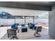 Covered patio with comfortable seating and a fire pit creates an inviting outdoor entertaining space at 12829 Kings Lake Dr, Gibsonton, FL 33534