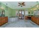 Luxurious bathroom featuring dual vanities, a soaking tub, and french doors to the outside at 37511 Washington Loop Road, Punta Gorda, FL 33982