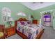 Cozy bedroom with a floral bedspread, lamps, and bedside tables, creating a relaxing retreat at 37511 Washington Loop Road, Punta Gorda, FL 33982