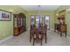 The dining room offers elegant furnishings, a large dining table, and natural light at 37511 Washington Loop Road, Punta Gorda, FL 33982