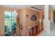 Foyer featuring a chandelier, staircase, glass railing, and a large window at 37511 Washington Loop Road, Punta Gorda, FL 33982