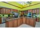 Spacious kitchen with a large island, stainless appliances, and wooden cabinets at 37511 Washington Loop Road, Punta Gorda, FL 33982