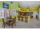 Bright kitchen and breakfast nook boasts lots of light, bar seating, and modern appliances at 37511 Washington Loop Road, Punta Gorda, FL 33982