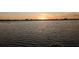 Stunning view of lake at sunset. Serene waters reflect the golden colors of the sky, creating a peaceful ambiance at 37511 Washington Loop Road, Punta Gorda, FL 33982
