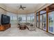Enjoy breathtaking views from this living room featuring large windows and comfortable seating at 37511 Washington Loop Road, Punta Gorda, FL 33982