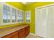 Bright office space with custom cabinetry and natural light provides a comfortable workspace at 37511 Washington Loop Road, Punta Gorda, FL 33982