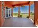 Spacious outdoor patio offers serene views of the surrounding landscape and a perfect spot for relaxation at 37511 Washington Loop Road, Punta Gorda, FL 33982