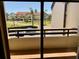 Balcony offering views of the community, landscaping and parking area at 115 1St E St # 103, Tierra Verde, FL 33715