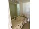 Bathroom with tiled floors, single vanity, and toilet at 115 1St E St # 103, Tierra Verde, FL 33715