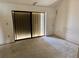 View of an unfurnished bedroom with a sliding glass door at 115 1St E St # 103, Tierra Verde, FL 33715