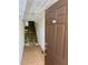 Entryway with tiled floor, carpeted stairs, and an entrance door at 115 1St E St # 103, Tierra Verde, FL 33715