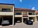 Inviting condo with a terracotta tile roof, carports, and beautiful curb appeal at 115 1St E St # 103, Tierra Verde, FL 33715