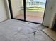Sliding glass door in living room that leads to a balcony with a scenic view at 115 1St E St # 103, Tierra Verde, FL 33715