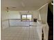Spacious living room featuring tile floors, open layout and staircase at 115 1St E St # 103, Tierra Verde, FL 33715