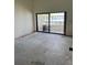 Unfurnished room with sliding glass door leading to balcony at 115 1St E St # 103, Tierra Verde, FL 33715
