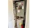 Utility closet with water heater, HVAC system, and electrical panel at 115 1St E St # 103, Tierra Verde, FL 33715