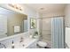Well-lit bathroom features a shower-tub combination and contemporary fixtures at 11212 3Rd E Ave, Bradenton, FL 34212