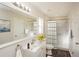 Well-lit bathroom features a shower-tub combination and contemporary fixtures at 11212 3Rd E Ave, Bradenton, FL 34212