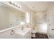 Well-lit bathroom with a modern vanity, large mirror, and shower at 11212 3Rd E Ave, Bradenton, FL 34212