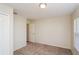 This bedroom has carpet with neutral paint and natural light from the window at 11212 3Rd E Ave, Bradenton, FL 34212
