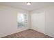 This bedroom has carpet and a large window for natural light, and a closet at 11212 3Rd E Ave, Bradenton, FL 34212