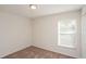 A bright bedroom is carpeted with a neutral color and natural light from the window at 11212 3Rd E Ave, Bradenton, FL 34212