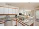Bright kitchen featuring granite countertops, stainless steel appliances and an open floor plan at 11212 3Rd E Ave, Bradenton, FL 34212