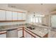 Well-appointed kitchen with granite countertops, stainless steel appliances, and eat-in breakfast bar at 11212 3Rd E Ave, Bradenton, FL 34212