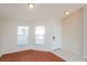 Open living area with bright windows and tile entry, seamlessly blending comfort and style at 11212 3Rd E Ave, Bradenton, FL 34212