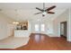 Open-concept living space with views into the kitchen, featuring hardwood floors and vaulted ceilings at 11212 3Rd E Ave, Bradenton, FL 34212