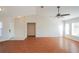 Inviting living room with wood floors, vaulted ceilings, and an abundance of natural light at 11212 3Rd E Ave, Bradenton, FL 34212
