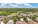 Beautiful aerial view of the home, showcasing nearby lush greenery and serene lake at 12784 Burns Dr, Odessa, FL 33556
