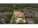Bird's eye view of a home, showcasing its proximity to a serene lake in a lush neighborhood at 12784 Burns Dr, Odessa, FL 33556