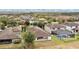 Aerial view featuring the backyard, patio, private pool, and green space, set in a peaceful suburban neighborhood at 12784 Burns Dr, Odessa, FL 33556