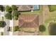 Bird's eye view of a home showing the roof, backyard, and landscaping in a quiet neighborhood setting at 12784 Burns Dr, Odessa, FL 33556