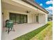Spacious covered back porch featuring a ceiling fan and room for entertaining at 12784 Burns Dr, Odessa, FL 33556