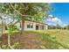 The backyard offers ample space and privacy with a view of the screened pool at 12784 Burns Dr, Odessa, FL 33556