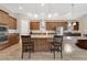 Stylish kitchen with a large island, granite countertops, stainless steel appliances, and ample cabinet space at 12784 Burns Dr, Odessa, FL 33556