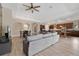 Spacious living area featuring wood-look tile flooring, neutral walls, and an open floor plan, perfect for entertaining at 12784 Burns Dr, Odessa, FL 33556