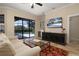 Comfortable living room with a view of the pool, a large television, a wine cooler, and stylish furniture at 1751 Bobcat Trl, North Port, FL 34288