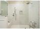 Spa-like shower with marble tile, bench seating, and a rainfall showerhead at 1751 Bobcat Trl, North Port, FL 34288