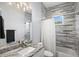 Modern bathroom with granite vanity, tiled shower, and stylish fixtures for a luxurious experience at 3244 55Th Ave N, St Petersburg, FL 33714