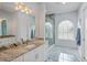 Primary bathroom features marble floors, granite countertops, and a glass shower at 3244 55Th Ave N, St Petersburg, FL 33714
