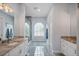 Bathroom features marble flooring, granite countertops, and a glass enclosed shower at 3244 55Th Ave N, St Petersburg, FL 33714