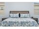 Comfortable bedroom features a padded headboard, matching nightstands and a calm color palette at 3244 55Th Ave N, St Petersburg, FL 33714