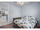 Bedroom features a ceiling fan, a window, and a doorway leading into another room at 3244 55Th Ave N, St Petersburg, FL 33714