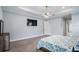 Spacious primary bedroom features tray ceilings, recessed lighting, and a ceiling fan at 3244 55Th Ave N, St Petersburg, FL 33714