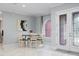 Bright dining room with marble floors and an arched window letting in natural light at 3244 55Th Ave N, St Petersburg, FL 33714